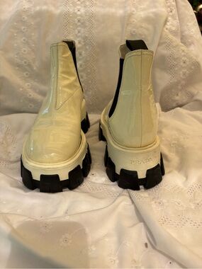 Prada Cream Patent Leather Chelsea Lug Boots with Black Sole